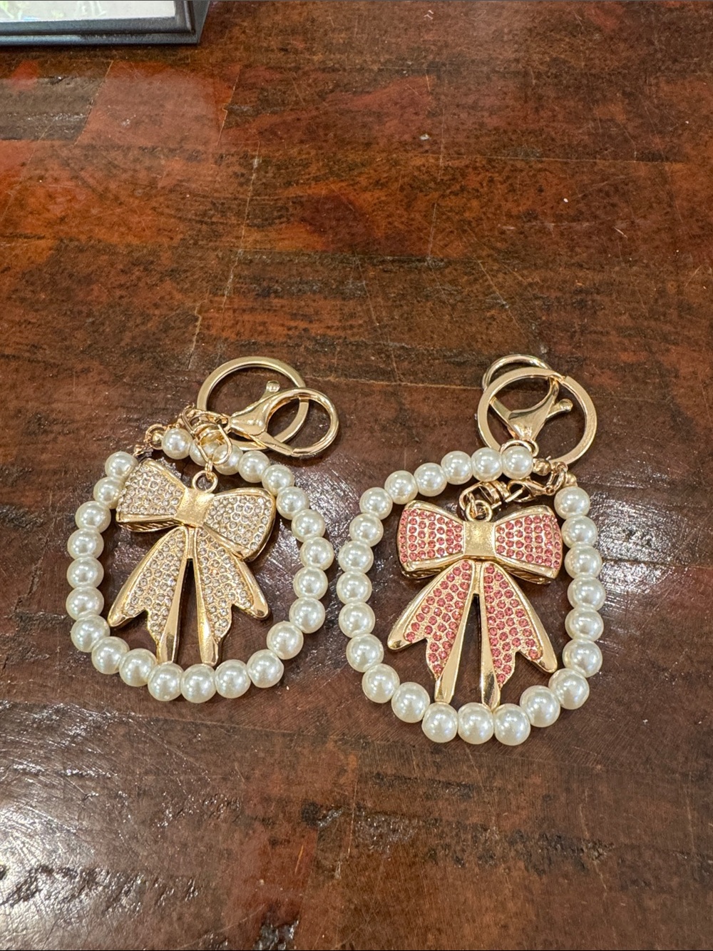 Guess Gold-Tone Bow & Pearl Circle Keychain with Pink Crystals